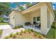Inviting front porch with stylish outdoor seating and manicured landscaping at 1371 Lake Dr, Casselberry, FL 32707