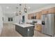 Bright, open kitchen with a spacious center island, stainless steel appliances, and abundant storage at 1371 Lake Dr, Casselberry, FL 32707