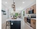 Bright open kitchen with a large island, pendant lighting, and view to the living room at 1371 Lake Dr, Casselberry, FL 32707