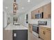 Contemporary kitchen equipped with a center island, stainless steel appliances, and sleek countertops at 1371 Lake Dr, Casselberry, FL 32707