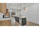 Modern kitchen featuring a center island with a sink, stainless steel appliances, and wood flooring at 1371 Lake Dr, Casselberry, FL 32707