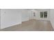 Open living room space showcasing new flooring, and crisp white walls, with natural light at 1371 Lake Dr, Casselberry, FL 32707