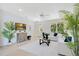 Cozy living room with stylish furniture, decorative plants, and plenty of natural light at 1371 Lake Dr, Casselberry, FL 32707