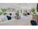 Spacious living room flows into dining area and kitchen, complete with white sofas at 1371 Lake Dr, Casselberry, FL 32707