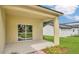 Covered back patio area featuring sliding glass doors and a view of the backyard and neighboring home at 1371 Lake Dr, Casselberry, FL 32707