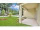 Welcoming covered porch with updated landscaping and a view of the surrounding neighborhood at 1371 Lake Dr, Casselberry, FL 32707
