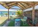 Charming covered outdoor seating area with comfortable chairs, ideal for relaxation at 139 Randle Ave, Oak Hill, FL 32759