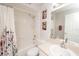 Clean bathroom featuring a shower-tub combo, vanity with sink, and neutral decor at 139 Randle Ave, Oak Hill, FL 32759