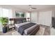 Comfortable staged bedroom with neutral tones, plush bedding, ceiling fan, and closet space at 139 Randle Ave, Oak Hill, FL 32759