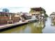 Beautiful private boat dock featuring a large deck, boat lift, and plenty of space for entertaining at 139 Randle Ave, Oak Hill, FL 32759