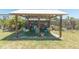 Backyard gazebo featuring seating and artificial turf at 139 Randle Ave, Oak Hill, FL 32759