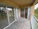 View of the balcony with sliding glass doors providing access to the outside at 14025 Fairway Island Dr # 335, Orlando, FL 32837