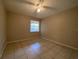 Bright bedroom features a ceiling fan and a window, offering comfortable living space at 14025 Fairway Island Dr # 335, Orlando, FL 32837