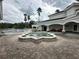 View of the community pool and water fountain feature, along with the covered pavilion at 14025 Fairway Island Dr # 335, Orlando, FL 32837