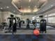 Well-lit fitness center with ceiling fans and a variety of workout equipment at 14025 Fairway Island Dr # 335, Orlando, FL 32837