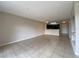 Open living room with tile flooring view of kitchen and entry door at 14025 Fairway Island Dr # 335, Orlando, FL 32837