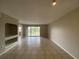 Bright living room with tile flooring, slider to patio, and neutral paint at 14025 Fairway Island Dr # 335, Orlando, FL 32837