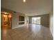 Open-concept living room with tile flooring and slider to patio; bathroom is visible at 14025 Fairway Island Dr # 335, Orlando, FL 32837