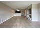 Spacious living room with tile flooring leading to the kitchen at 14025 Fairway Island Dr # 335, Orlando, FL 32837