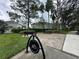 An outdoor seating area offers a bike rack, nearby benches and beautiful landscaping at 14025 Fairway Island Dr # 335, Orlando, FL 32837