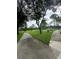 View of the paved community walking paths, mature trees and landscaping at 14025 Fairway Island Dr # 335, Orlando, FL 32837