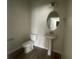 Bathroom with small toilet and sink at 1407 Mount Royal Dr, St Cloud, FL 34771