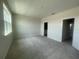 Bright primary bedroom featuring carpet floors and natural light at 1407 Mount Royal Dr, St Cloud, FL 34771