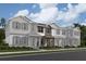 New construction townhomes feature a welcoming entry and charming architectural details, perfect for modern living at 1407 Mount Royal Dr, St Cloud, FL 34771