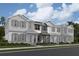 New construction townhomes feature a welcoming entry and charming architectural details, perfect for modern living at 1407 Mount Royal Dr, St Cloud, FL 34771