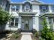 Charming townhome showcasing inviting front entrance and well-maintained landscaping at 1407 Mount Royal Dr, St Cloud, FL 34771