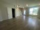 Open living room with tile flooring and staircase to the upper level at 1407 Mount Royal Dr, St Cloud, FL 34771
