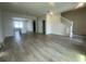 Open-concept living room with stairs, tile flooring, and lots of natural light at 1407 Mount Royal Dr, St Cloud, FL 34771