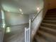 Bright living room with stairs leading to the upper level at 1407 Mount Royal Dr, St Cloud, FL 34771