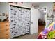 Well-organized bedroom featuring a closet with curtain and view to study area at 1430 Arrowhead Trl, Deltona, FL 32725