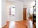 Hallway featuring hardwood floors and a view to other rooms of the house at 1430 Arrowhead Trl, Deltona, FL 32725