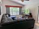 Inviting living room featuring a plush sectional sofa and a view of the outdoors at 1430 Arrowhead Trl, Deltona, FL 32725