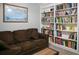 Inviting living room with comfortable seating and built-in shelving full of books at 1430 Arrowhead Trl, Deltona, FL 32725