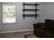 Relaxing living room with a comfortable couch and a view of the pool area at 1430 Arrowhead Trl, Deltona, FL 32725