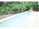 Backyard pool offers a relaxing retreat, surrounded by lush greenery at 1430 Arrowhead Trl, Deltona, FL 32725