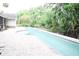 Gorgeous pool with brick-paver decking overlooks lush backyard at 1430 Arrowhead Trl, Deltona, FL 32725