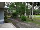 Home is situated on a large lot that is surrounded by mature trees at 1430 Arrowhead Trl, Deltona, FL 32725