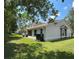 The backyard features a well-maintained lawn and privacy at 14844 Laguna Beach Cir, Orlando, FL 32824