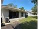 The backyard boasts a screened lanai, A/C unit, and trash receptacles at 14844 Laguna Beach Cir, Orlando, FL 32824