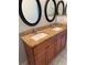 Bathroom featuring a double sink vanity with granite countertops and modern fixtures, providing style and convenience at 14844 Laguna Beach Cir, Orlando, FL 32824