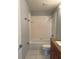Full bathroom with a tiled shower-over-tub combination, toilet, and vanity with granite countertop and tiled flooring at 14844 Laguna Beach Cir, Orlando, FL 32824
