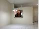 Bright, open dining room features tile floors and pass-through to the kitchen at 14844 Laguna Beach Cir, Orlando, FL 32824