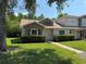 Charming home with a well-manicured lawn and mature landscaping at 14844 Laguna Beach Cir, Orlando, FL 32824
