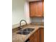 Kitchen features updated granite countertops, stainless steel sink, and stainless steel hardware at 14844 Laguna Beach Cir, Orlando, FL 32824