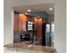 Pass-through provides seamless transition from the dining room to the updated kitchen at 14844 Laguna Beach Cir, Orlando, FL 32824