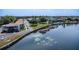 Waterfront condos featuring a private dock and boat slips on a calm lake setting surrounded by trees at 151 N Orlando Ave # 204, Winter Park, FL 32789